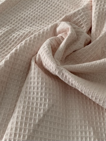 Tissu nid d'abeille rose clair