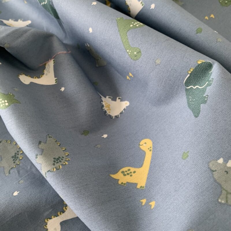 Tissu coton motifs bébé dinosaures