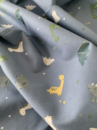 Tissu coton motifs bébé dinosaures
