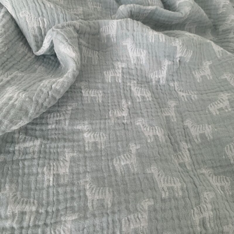 Tissu double gaze vert d'eau et zèbres